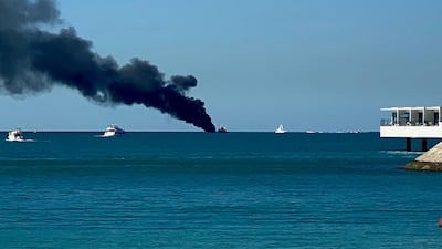 A vessel on fire off the coast of Dubai, near Burj Al Arab. Farah Andrews / The National