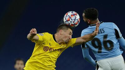 Dortmund's Thomas Meunier and Mohamed Fares of Lazio challenge for a header. Getty