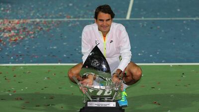 Roger Federer poses with the Dubai Duty Free Tennis Championships trophy after defeating Novak Djokovic to retain the title he won for a sixth time last year. Kamran Jebreli / AP Photo