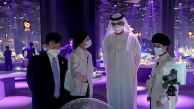 Dr Sultan Al Jaber examines sustainability innovations in the Japan pavilion at Expo 2020 Dubai. Photo: Ministry of Industry and Advanced Technology