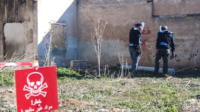 The Halo team checks an unexploded Urgan rocket left in Luf village, Idlib. Photo: Paul McCann / Halo