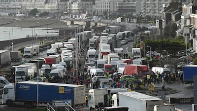 Drivers stand with their HGV freight lorries blocking the entrance trying to enter the port of Dover in Kent. AFP