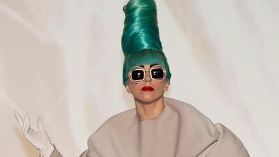 Lady Gaga, in a taupe gown, at a press conference ahead of her performance at the ArtScience Museum on June 7, 2011 in Singapore. Getty Images