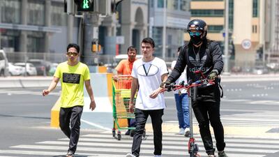 Electric scooters are popping up across Abu Dhabi with more than 100,000 users in the emirate. Victor Besa / The National