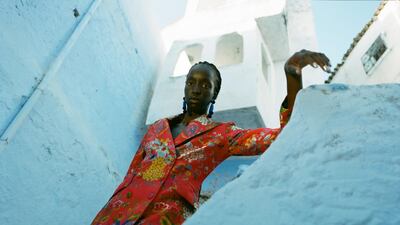 Blazer, Dh6,243; trousers Dh3,290, both from Etro. Earrings, Dh55, Asos