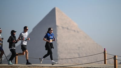 Participants take part in the seventh annual Pyramids Half Marathon at the Pyramids of Giza, Egypt, 13 December 2025. The event brings together runners from around the world to compete under the slogan Race Through History, offering distances of 21 km, 10 km, and 5 km. EPA / Mohamed Hossam