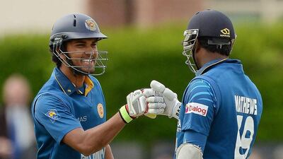 Sri Lanka cricket players Dinesh Chandimal, left, and captain Angelo Mathews celebrate during their ODI win over Ireland on Tuesday. Artur Widak / AFP / May 6, 2014