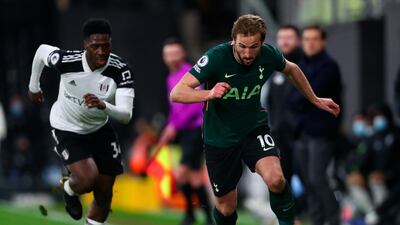 Tottenham's Harry Kane in action by Fulham's Ola Aina during the English Premier League soccer match between Fulham FC and Tottenham Hotspur in London, Britain. EPA