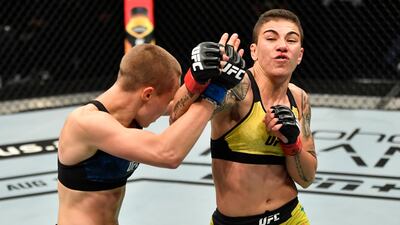 Jessica Andrade of Brazil, right, punches Rose Namajunas in their strawweight fight during the UFC 251 event at Flash Forum on UFC Fight Island on July 12, 2020 on Yas Island, Abu Dhabi, United Arab Emirates. Jeff Bottari / Zuffa LLC / Getty Images