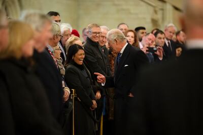 Charles speaks to MP Priti Patel. AP