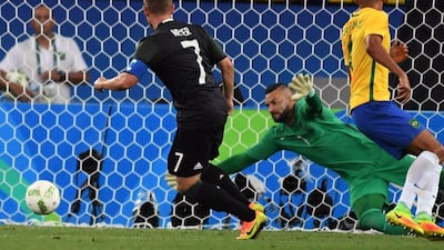 Germany midfielder Maximilian Meyer (L) scores his team’s first goal during the Rio 2016 Olympics men’s football gold medal match between Brazil and Germany at the Maracana stadium in Rio de Janeiro on August 20, 2016. Luis Acosta / AFP