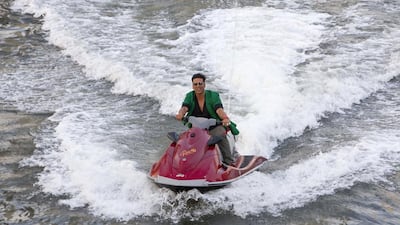 Akshay Kumar arrives via jet ski to a yacht specially chartered for the press conference launch of his new movie release titled BOSS. Antonie Robertson / The National