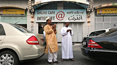 Men offer sunrise prayers outside the Sheka Abd Allah Alzaabi Mosque in the Nadi Alciahi neighborhood during the first day of EID.