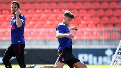 Spanish La Liga soccer club Atletico Madrid of Spanish midfielder Marcos Llorente (R) during his team's training session at the club's sport complex in Majadahonda, near Madrid, Spain, May 30, 2020. EPA