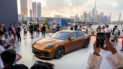 Attendees at Icons of Porsche get shots of the 2024 Panamera. All photos: Porsche