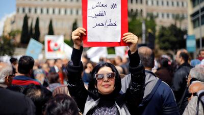 A protester's placard reads "Salary of the poor is a red line". Government plans to restructure Lebanon's electricity sector have been around for years, and demonstrators' voices have grown louder as the country's financial and economic crisis deepens. AP Photo