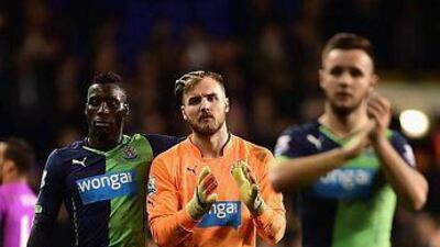 Goalkeeper Jak Alnwick, centre, of Newcastle United is consoled by Massadio Haidara of Newcastle United after their League Cup quarter-final match loss to Tottenham Hotspur at White Hart Lane on December 17, 2014 in London, England. (Photo by Jamie McDonald/Getty Images)