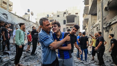 Palestinian civil defence members search for survivors after an Israeli bombardment in Khan Yunis, southern Gaza Strip. AFP
