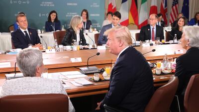 French President Emmanuel Macron, left (L rear), US President Donald Trump (C front), Canadian Prime Minister Justin Trudeau (C rear) and International Monetary Fund Managing Director Christine Lagarde (R front) attend the Gender Equality Advisory Council Breakfast during the G7 Summit in La Malbaie, Quebec, Canada. POOL FOR EPA