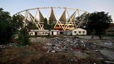 Garbage and junk strewn on the grounds of JawaharLal Nehru Stadium in New Delhi. One year after the Commonwealth Games in New Delhi, its organisers languish in jail on corruption charges and foreign companies are fighting legal battles over millions of dollars in unpaid bills. MANAN VATSYAYANA / AFP PHOTO