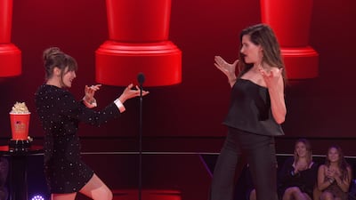 Elizabeth Olsen and Kathryn Hahn react while accepting the Best Fight award for 'WandaVision' during the 2021 MTV Movie & TV Awards in Los Angeles on May 16, 2021. Reuters