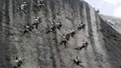 Indian army soldiers climb an ice wall near the Siachen Glacier in the eastern Karakoram Range of the Himalaya Mountains.