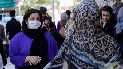 An Iranian woman wearing face mask goes shopping in Tehran, Iran. EPA