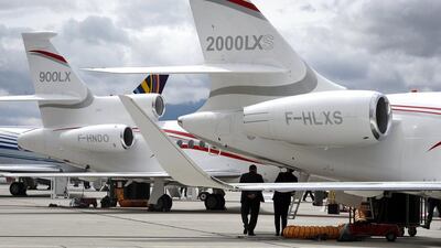 Visitors have a close look of a Dassault Aviation Falcon 2000LXS business jet at the European Business Aviation Convention & Exhibition. Fabrice Coffrini / AFP