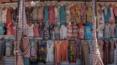 Faded clothing samples are seen hanging at a street stall in the resort town of Naama Bay.