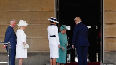 US President Donald Trump (R) and US First Lady Melania Trump (C) are greeted by Britain's Queen Elizabeth II (2R) after being met by Britain's Prince Charles, Prince of Wales (L) and Britain's Camilla, Duchess of Cornwall (2L) during a welcome ceremony at Buckingham Palace in central London on June 3, 2019, on the first day of the US president and First Lady's three-day State Visit to the UK. AFP
