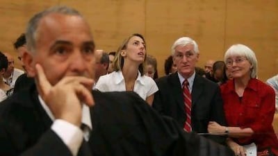 The Corrie family lawyer, Hussein Abu Hussein, sits in the foreground as Rachel's sister Sarah, father Craig and mother Cindy await a verdict over her death in Israel's Haifa District Court.