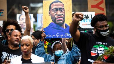 Three former Minneapolis police officers failed to intervene when their colleague knelt on George Floyd's neck, leading to his death. AFP