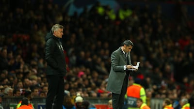 Barcelona manager Ernesto Valverde, right, and Manchester United manager Ole Gunnar Solskjaer watch on from the touchline. AP Photo