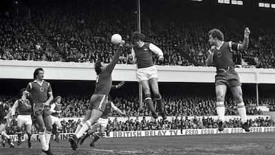 At last! After a run of ten winless games, Arsenal's David O'Leary heads the ball over a diving Mark Wallington to score his first goal and his team's second in a 3-0 win over Leicester City on April 2, 1977. Getty