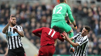 Salah sustains an injury after clashing with Newcastle United's Martin Dubravka. Scott Heppell / Reuters