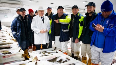 Prime Minister Boris Johnson with Will Clark, pointing, during his 2019 visit to Peterhead fish market. Pro-Brexit Mr Clark now says the industry was betrayed by the UK government. Getty