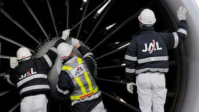 Japan Airlines maintenance personnel check a jet engine at Narita International Airport in Narita, east of Tokyo. The aviation imaging equipment specialist Olympus is to set up an aircraft maintenance facility in Dubai. Itsuo Inouye / AP Photo