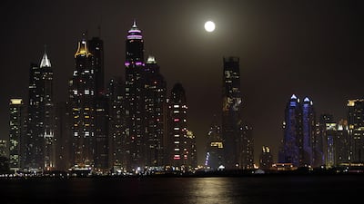 Capturing the moon low on the horizon would show its scale by contrasting it with elements of the skyline. Kamran Jebreili/AP Photo