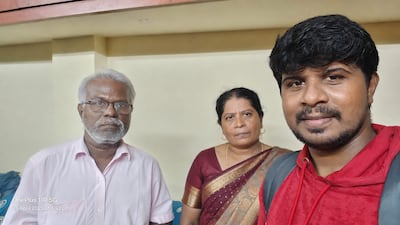Paul Justin with his parents at home in Alangulam village in southern India. Photo: Paul Justin