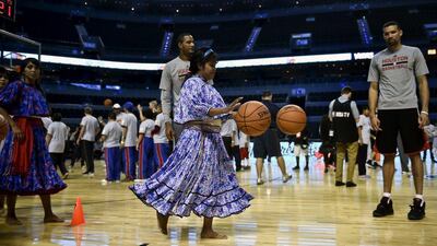 A member of the women's Taramahura basketball team take part in a clinic with players from the Houston Rockets in Mexico City on Tuesday. Yuri Cortez / AFP