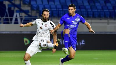 Al Nasr’s Sebastian Tagliabue, right, vies for the ball with Al Jazira defender Milos Kosanovic. Courtesy PLC