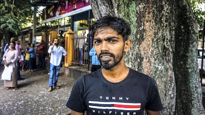 Rajan Wijesena, 29, waiting for relatives outside the National Hospital in Colombo. Jack Moore / The National.
