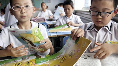 Near-sighted students wearing glasses at a primary school in China's Shandong province. Zheng xun / Imaginechina