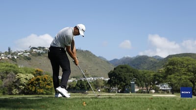 Collin Morikawa plays his shot from the seventh tee during the second round of the Sony Open in Hawaii. AFP