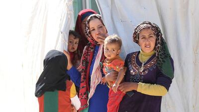 Syrian refugees stand at Zaatari refugee camp, close to the northern Jordanian city of Mafraq near the border with Syria in July. AFP