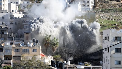 Israeli troops detonate the explosives