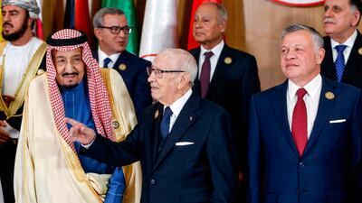 Tunisian President Beji Caid Essebsi (centre) gestures as he stands between Saudi Arabia's King Salman bin Abdulaziz (left) and Jordan's King Abdullah II (right) during the 30th Arab League summit in the Tunisian capital Tunis. AFP
