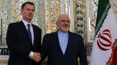 Iranian Foreign Minister Mohammad Javad Zarif greets Britain's Foreign Secretary Jeremy Hunt in Tehran / EPA