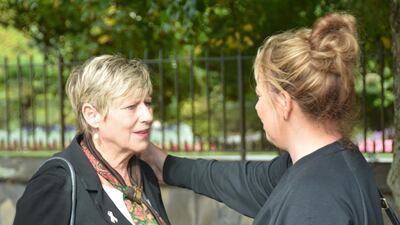 Christchurch Mayor Lianne Dalziel receives a show of support from a woman nearby the Rolleston Ave vigil. Steve Addison / The National