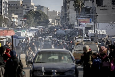 Palestinians walk through the Omar Mukhtar Market in Gaza city. AFP